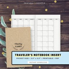 the traveler's notebook insert is next to a plant