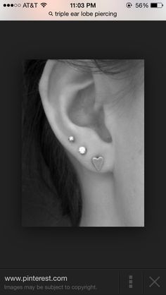 an ear piercing is shown in black and white