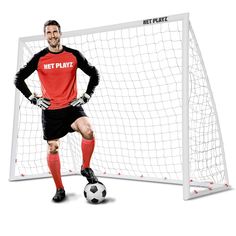 a man standing in front of a net playing soccer