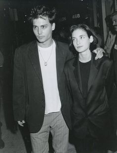 a man and woman standing next to each other