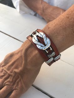 "Infinity leather Bracelet, leather cuff, magnetic clasp, Bohemian style, gift idea, for her, for him, unique design, handmade, leather How do I know what size I need? Just wrap a flexible measuring tape around your wrist and measure. The tape measure should rest on the wrist but not too tight. Just so that it feels comfortable for you. We plan on making \"space\" for opening and closing. Check out our \"Necklaces\" and \"Earrings\" for matching pieces ! can I choose different sizes ? Bracelets: Adjustable Bohemian Jewelry With Leather Strap, Unique Handmade Wrap Bracelet, Brown Jewelry With Leather Strap, Bohemian Wrap Bracelet With Sliding Knot, Adjustable Leather Bracelet For Festival, Bohemian Leather Bracelet As A Gift, Bohemian Leather Jewelry With Sliding Knot, Unique Festival Leather Bracelet, Brown Hand-wrapped Wrap Bracelet