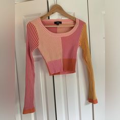 Soft And Stretchy Ribbed Cropped Sweater. Like New, Never Worn. Pink Color Block Top For Fall, Pink Stretch Patchwork Tops, Pink Long Sleeve Top With Contrast Color, Fitted Multicolor Contrast Top, Fitted Multicolor Contrast Color Top, Pink Fitted Patchwork Top, Fitted Pink Patchwork Top, Trendy Pink Ribbed Crop Top, Trendy Fitted Color Block Crop Top