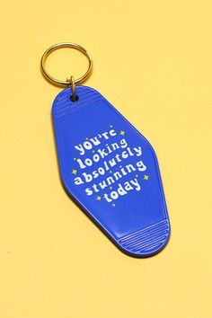 a blue keychain with the words you're looking absolutely shining today on it