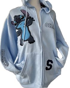 This Disney Stitch hoodie is perfect for any fan of the beloved character. The light blue color and stitch embroidered patches make it a unique addition to any wardrobe. The hoodie features a full zip closure, V-neckline, and regular long sleeves with a regular fit. It is made of a comfortable cotton blend material that is machine washable for easy care. The hoodie is great for all seasons, including winter, summer, fall, and spring, and can be worn for various activities such as basketball, run Casual Fitted Blue Hoodie, Blue Fitted Casual Hoodie, Casual Embroidered Hoodie For College, Stitch Costume Women, Casual Embroidered Hoodie, Casual Embroidered Hoodie With Relaxed Fit, Fitted Blue Cotton Hoodie, Casual Embroidered Relaxed Fit Hoodie, Lilo And Stitch Clothes