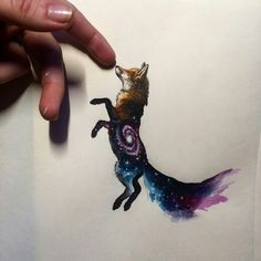 a drawing of a fox is being held up by someone's hand with space on it