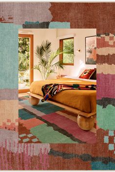 a bed sitting in the middle of a bedroom next to a large window with a potted plant on top of it