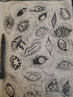 an open notebook with some drawings on it