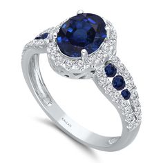 This classic sapphire and white diamond ring set in 14k white gold is a sophisticated piece from our HEIRLOOM collection. This ring features 2.10 CTW of white diamonds and sapphires. Our HEIRLOOM collection features colored gemstones - precious rubies, emeralds, tanzanites, and sapphires. In this collection, you will find an array of rich designs from statement cocktail rings to brilliant earrings and pendants characterized by a precious gemstone set in gold and accented with diamonds. Metal: 14 Luxury Heirloom Sapphire Ring With Round Cut, Luxury Heirloom Sapphire And Diamond Ring, Luxury Heirloom Round Sapphire Ring, Luxury Heirloom Sapphire Ring In Diamond White, Classic Sapphire Rings With Pave Setting, Classic Sapphire Ring With Pave Setting, Fine Jewelry Lab-created Sapphire Ring With Halo Design, Sapphire Cubic Zirconia Ring With Pave Setting, Luxury Sapphire Diamond Ring In 14k White Gold