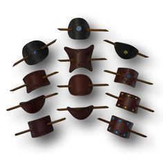 a bunch of different hats and sticks on a white background