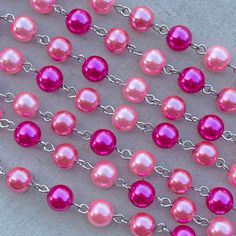 "This fun pink glass pearl chain has a bright look that would be wonderful for all of your vintage designs. This chain features glowing glass pearls in fabulous pinks and fuchsias. As a jewelry designer and wearer, sometimes you need a pink pearl chain that will go with everything! Pair this chain with striking pendants or wear it long and layered for a lovely shabby look. This specialty beaded chain is made with 8mm round glass pearls. The wire links are made of a base metal alloy that has been Pink Pearl Necklace, Shabby Look, Rhinestone Cross, Jewelry Chain, Bird Pendant, White Freshwater Pearl, Pearl Chain, Pink Pearl, Jewelry Designer