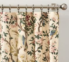 a curtain with birds and flowers on it