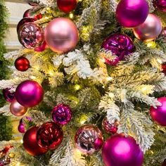 a christmas tree with purple and red ornaments