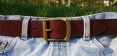 The Dunham Roller Leather Belt is bench crafted from a sturdy bridle harness leather with a unique antique roller buckle for a classic casual jean look. Handmade in 1-1/2" width from Cape Cod Leather Belts. Please Mention Buckle Finish in Order Notes !  American Made in USA. Vintage Belts With Brass Buckle For Everyday Use, Vintage Bridle Leather Belt For Everyday Use, Casual Leather Belt Buckles For Everyday, Casual Leather Belt With Brass Buckle, Everyday Leather Belts With Brass Hardware, Casual Leather Belt Buckles With Antique Buckle, Vintage Leather Belt Rectangular Shape, Leather Belt Buckles With Brass Buckle For Everyday, Rugged Leather Belt Buckles For Everyday Use