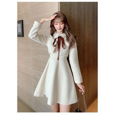 Solid Lace-up Bow Tie Peter Pan Collar Fake 2 Piece Woolen Dress BE120 S: Length:85CM, Bust:86CM, Waist:70CM,Shoulder:35CM,Sleeve Length:55CM M: Length:86CM, Bust:90CM, Waist:74CM,Shoulder:36CM,Sleeve Length:56CM L: Length:87CM, Bust:94CM, Waist:78CM,Shoulder:37CM,Sleeve Length:57CM XL:Length:88CM,Bust:98CM, Waist:82CM,Shoulder:38CM,Sleeve Length:58CM XXL:Length:89CM,Bust:102CM,Waist:86CM,Shoulder:39CM,Sleeve Length:59CM Silhouette: A-LINENeckline: Peter pan CollarSleeve Style: RegularDecoration: BowStyle: Preppy StyleDresses Length: Above Knee, MiniMaterial: Polyester, WoolClosure Type: zipperSleeve Length(cm): FullType: RegularFabric Type: WoolenPattern Type: Solid Cream A-line Winter Dress, Fall A-line Midi Dress For Office, White A-line Long Sleeve Dress For Fall, Beige Mini Dress For Winter Day Out, Winter Beige Mini Dress For Day Out, Elegant Beige Collared Mini Dress, Feminine A-line Mini Dress For Fall, Beige A-line Winter Dress, Beige Long Sleeve Dress For Day Out