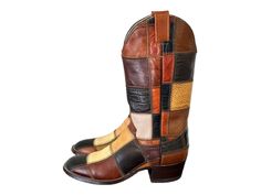 Size 6.5 Vintage mid calf genuine leather multi color pull on women cowboy boots. These amazing boots were made in the 1980s in the USA. They are 100% leather, upper, lining and soles. These beautiful boots are by Larry Mahan. The craftsmanship is just incredible. Size 6.5B height: 13" length: 10.25" insole: 9.5" width: 3.5" calf: 13" heel: 1.75" Material: leather  Color: brown, multi color Condition: Excellent Vintage (please see measurements all items returned because of non fit will be subject to a $35.00 restock fee). Women Cowboy Boots, Cowboy Boots Women, Beautiful Boots, Vintage Boots, Cowboy Western, Western Cowboy Boots, Dream Shoes, Cowgirl Boots, Brown Boots