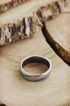 Simplicity is a charm! Engraved lines, a unique oxidized look, and sterling silver create a band you'll never want to take off. Add a personalized touch by having it engraved on the inside. A gift to wear all day, every day! PRODUCT DETAILS The ring is 5.6mm wide (approx. 0.22in) and 1.7mm thick (approx. 0.06in). The ring is oxidized to bring out its unique look. OPTIONS --> The ring is available in many different sizes. You may choose the one you wish from the drop-down menu. If you prefer a Etched Promise Ring Jewelry, Sterling Silver Etched Jewelry For Promise, Etched Round Band Promise Jewelry, Silver Etched Jewelry For Promise, Minimalist Etched Jewelry For Promise, Minimalist Etched Jewelry For Anniversary, Minimalist Etched Promise Jewelry, Antique Silver Engraved Ring With Oxidized Finish As Gift, Sterling Silver Jewelry With Engraving Option For Promise