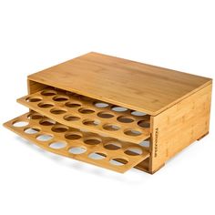 two wooden trays stacked on top of each other with holes in the bottom and sides