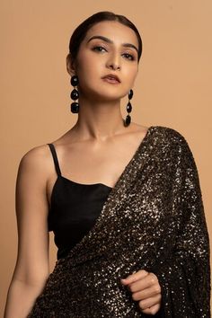 Black pre-draped saree with all over sequin embellishments. Paired with a padded blouse. - Aza Fashions Evening Draped Blouse Piece With Mirror Work, Festive Pre-draped Saree For Party Season, Fitted Draped Blouse Piece With Sequins, Fitted Draped Sequin Blouse Piece, Draped Blouse For Diwali Evening, Draped Blouse For Evening Diwali Celebrations, Draped Evening Blouse For Diwali, Draped Blouse For Evening And Diwali, Elegant Draped Blouse With Sequins