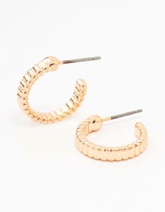 Add some flair to your style with these fabulous gold rippled huggie earrings! Their unique design adds glamour and eye-catching appeal, making them a wardrobe must-have day or night. Pair with your favourite top and jeans for an instant glamorous upgrade! Dimensions: Length 15 mm x Width 15 mm Weight: 0g | Lovisa Gold Rippled Huggie Earrings Top And Jeans, Huggie Earrings, Huggies Earrings, Your Style, Unique Design, Unique Designs, Wardrobe, Gold, Design