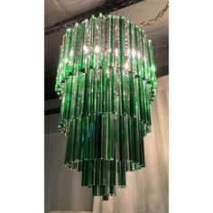 a green chandelier hanging from the ceiling