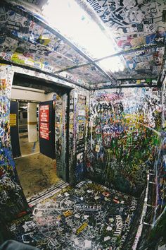 graffiti is all over the walls and ceiling