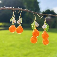 🙂Happiness, sunshine, health and warmth are the symbols of oranges.      Purity and peace are the meaning of the little white flower. These oranges earrings bring sincere blessings whether for your own use or as a gift for the one you love. May these earrings brighten up your life. 🙂 All my jewellery is designed and made in my home. Handmade with love.   Short oranges earrings Length: 4.5 cm or 1.77 inches  Long oranges earrings Length: 5.7 cm or 2.24 inches  🙂Introducing our stunning handmade earrings, a pair of earrings made with glass oranges and 925 anti-allergy silver hooks. The overall design is natural and unique, lovely and vibrant. The earrings are brightly coloured and striking for the unique you. Each pair of earrings is carefully handcrafted to ensure that every detail is pe Birthday Earrings, Earrings Food, Glass Fruit, Food Earrings, Fruit Earrings, Small White Flowers, Orange Earrings, Floral Jewellery, Birthday Gift For Her