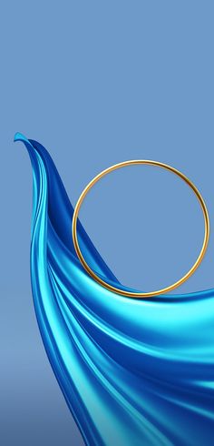 a gold ring sitting on top of a blue cloth