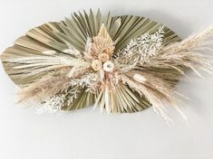 a piece of art made out of paper and feathers