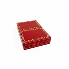 a red box with gold trimmings on the top and bottom, sitting against a white background