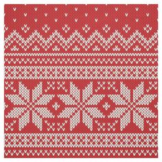 a red and white knitted background with snowflakes