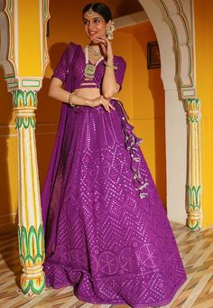 Readymade Faux Georgette Lehenga in Purple. This attire with Cotton and Shantoon Lining is Enhanced with Fancy Dangles, Resham, Mirror and Sequins Work. Available with a Faux Georgette Purple Choli Crafted in V Neck and Half Sleeves and a Faux Georgette Dupatta in Purple. The Choli and Lehenga Lengths are 15 and 42 inches respectively. We sell all kinds of Lehenga and Chaniya Choli Casual Lehenga |Sangeet Lehenga Choli |Wedding Lehenga Choli |Haldi Lehenga Choli |Mehandi Lehenga Choli |Chaniya C Purple Choli, Casual Lehenga, Lehenga Sangeet, Gujarati Chaniya Choli, Indowestern Lehenga, Party Lehenga, Skirt Traditional, Diwali Wear, Sangeet Lehenga