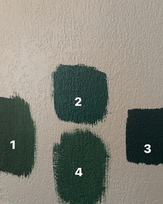 four different shades of green paint with numbers on the bottom and one in the middle