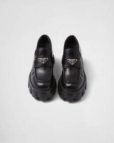 Black Brushed Leather Monolith Loafers | PRADA Black Calf Leather Platform Loafers With Rubber Sole, Black Calf Leather Platform Loafers With Leather Sole, Black Calf Leather Platform Loafers With Lug Sole, Luxury Leather Shoes With Vibram Sole For Work, Luxury Leather Work Shoes With Vibram Sole, Luxury Loafers With Vibram Sole And Round Toe, Black Leather Platform Loafers With Rubber Sole, Black Leather Platform Loafers With Leather Sole, Black Leather Loafers With Vibram Sole