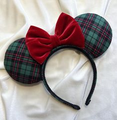 Get into the Christmas spirit with this cute Green Plaid & Red Velvet Bow Mouse Ears. All ears are handmade and made to order. Each pair is high quality, as I spend a great deal of time on each individual pair. Print placement, colors and accessories may vary slightly from the item pictured, however, every effort will be made to duplicate the item as pictured. The headband used for all ears fits most children and adults (this headband is very comfortable and does not pinch behind the ears). Cust Disney Ears Christmas, Christmas Minnie Ears, Christmas Disney Ears, Christmas Mickey Ears, Universal Christmas, Christmas Florida, Mouse Ears Disney, Muppets Christmas, Disney Apparel