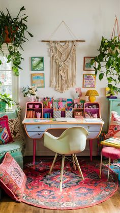 a room filled with lots of colorful furniture and potted plants on top of it