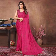 Rani Pink colored saree is made from georgette rangoli silk (Poly Silk) fabric which is highlighted with beautiful mukaish & foil printed work with tassels border as shown. comes along unstitched banglori silk blouse piece which you can customise as per your design/style. Occasion - You can buy this saree for party and functions. Note:- The actual product may differ slightly in color and design from the one illustrated in the images when compared with computer or mobile screen. Measurements: Sar Festive Georgette Saree With Bandhani Print, Festive Bandhani Print Georgette Saree, Party Wear Bandhani Print Georgette Saree, Party Georgette Saree With Bandhani Print, Party Saree With Bandhani Print On Georgette, Diwali Pre-draped Saree In Georgette With Bandhani Print, Georgette Saree With Printed Border For Diwali, Party Dupatta With Printed Border In Georgette, Georgette Saree For Puja And Eid