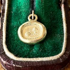 This solid 9k yellow gold pendant featuring very sweet rebus puzzle. This antique wax seal dates from the 1700's and is what it known as a 'rebus puzzle'. It is a play on words using images as well as words. When you realize the meaning of the message, it is sweet, sentimental and romantic. It features the words: For (yew tree) (eye) live or For You I Live Simple yet very lovely :-) Size This pendant charm measures 12.5mm and has a nice solid weight for it's size. This might alter slightly from Antique Engraved Jewelry For Good Luck, Live Simple, Rebus Puzzles, Yew Tree, Antique Wax, Yellow Gold Pendants, Wax Seal, Wax Seals, Gold Pendant