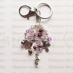 a close up of a key chain with charms on it