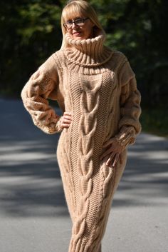 "Hand knitted long sweater dress made from pure soft merino wool. The measurements of the dress at the pictures are given below. Alternations in the width are possible,but please have in mind that this will result in minor changes in the knit pattern as well. That is the reason why the dress is described as a \"One size\" dress. Colour is camel beige - as seen at the pictures.Yet,please bear in mind that the colour may appear differently on your screen because of your device`s colour settings an Brown Sweater Dress, Wool Sweater Dress, Long Knit Sweater, Long Sweater Dress, Wool Jumper, Thick Sweaters, Cable Sweater, Mohair Sweater, Sweaters Online