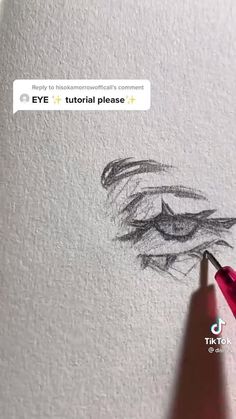 someone is drawing an eye with a pencil