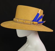 Mexican Handcrafted Boater Hat | 3 Plumas A complete head-turner & unique Men & Women’s Mexican artisan wide brimmed wool felt hat on this Spanish-form in Elegant Dijon Mustard color with Gold platted mini skulls around leather hatband & blue feathers elegantly dipped in a gold-color for a sophisticated look! SIZE See “Size Chart” below, or CLICK HERE DETAILS Sombrero Box Inner-elastic band (comfortable sizing) Luxury Fitted Toquilla Straw Boater Hat, Tooled Leather Handbags, Modern Hat, Blue Feathers, Mexican Fashion, Straw Fedora Hat, Painted Hats, Handmade Hair Clip, Boater Hat