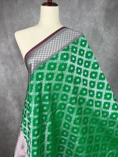 Beautiful Green and Pink Handmade Dupatta with Sliver Zari Weave Super Light weight and very easy to carry. Can be worn with a Suit or lehenga easily. Item: DupattaBase color : Peach Zari Work : Gold Fabric : Premium quality Banarasi Soft SilkWork : Zari Weaved with tasselsLength of the dupatta : 92 inches Width of the dupatta : 37 inches Store Policies - No return or exchange will be accepted for color variations. - No return or exchange will be accepted if the color does not match your other clothing or your partners or anyone else.- Since this Dupatta is handmade hence little inconsistencies may be there however it is not considered as a defect.- Zari coming out or on folds is not considered as defects. - Slight variation in actual color vs. image is possible due to the screen resolutio Silver Bollywood Dupatta For Transitional Season, Bollywood Style Silver Dupatta For Transitional Season, Silver Saree With Traditional Drape For Celebration, Silver Traditional Drape For Eid, Silver Saree For Celebration With Traditional Drape, Silver Saree For Celebration In Traditional Drape, Traditional Silver Saree For Celebration, Transitional Season Festive Silver Saree, Silver Dupatta With Traditional Drape For Eid