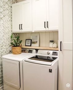 a white washer and dryer in a small room