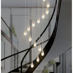 a spiral staircase with many lights hanging from it