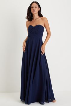 a woman in a strapless blue dress