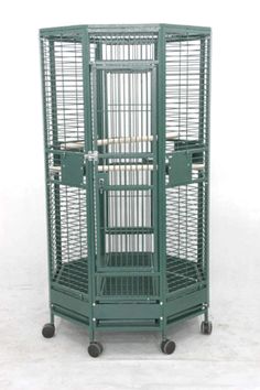 a large green bird cage with wheels