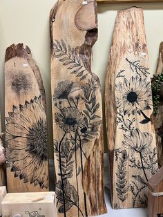 some wood carvings with flowers painted on them