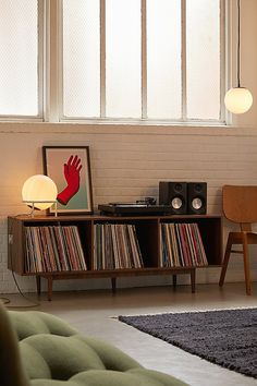 a living room with an entertainment center and record player