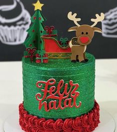 a christmas cake decorated with green frosting and red icing