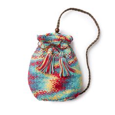 a colorful bag with tassels hanging from the side on a white background photo